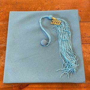 Light blue graduation cap with 2023 tassel